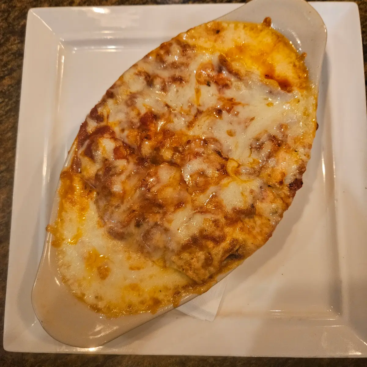 Baked pasta dinner with melted mozzarella