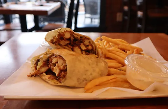 Chicken caesar grinder-style wrap with fries and ranch