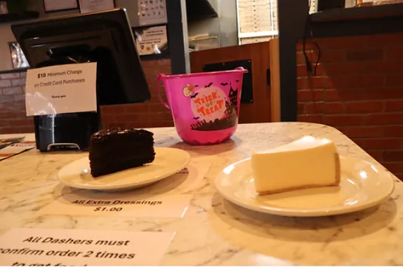 Cheesecake and chocolate cake on plates
