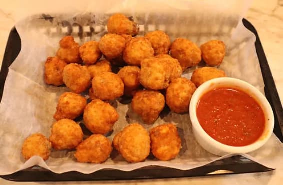 Fried mushrooms with marinara dipping sauce
